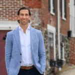 West Chester real estate agent Mike Ciunci in front of a West Chester home