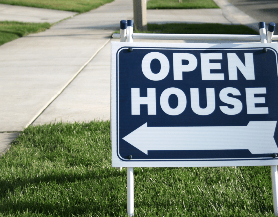 Open house sign in a front yard